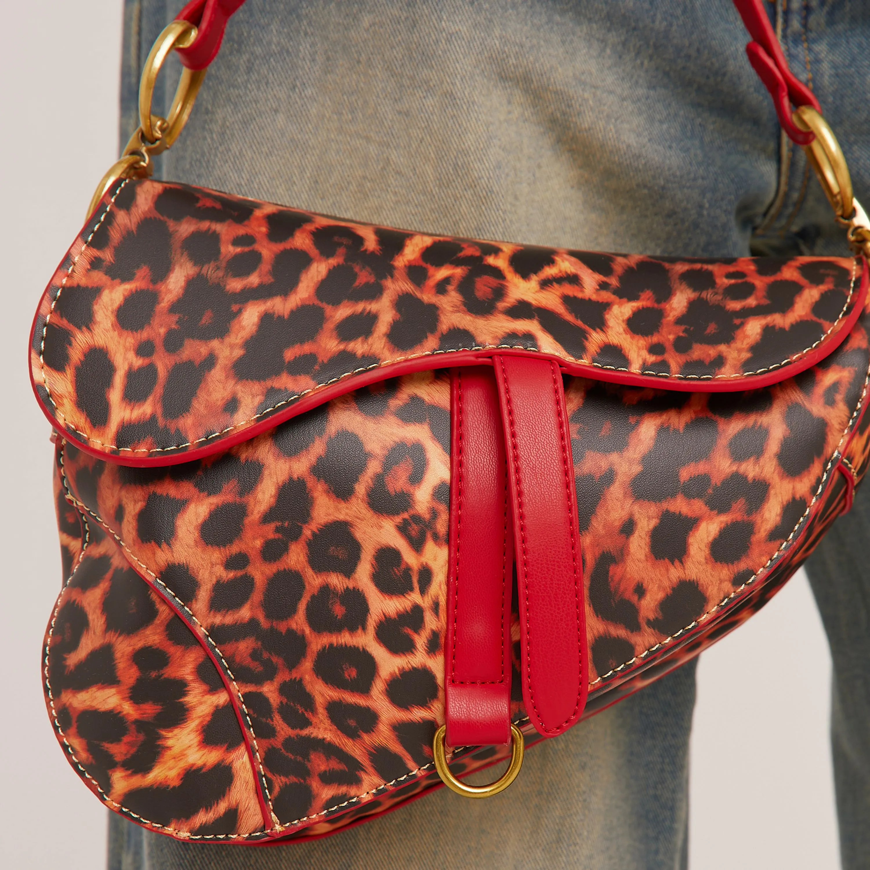 Issy Ring Detail Shaped Cross Body Saddle Bag In Leopard Print Faux Leather